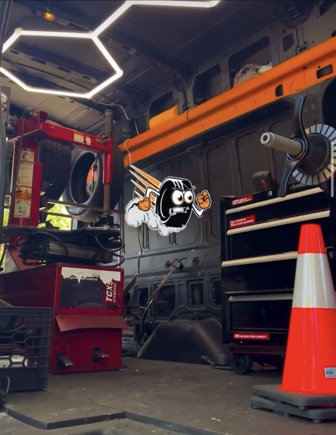 Inside the Mobile Tire Depot service van — professional tire changing machine and wheel balancer on board